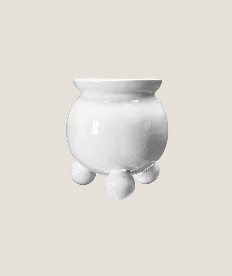 Anya kruka vit L med kulfötter